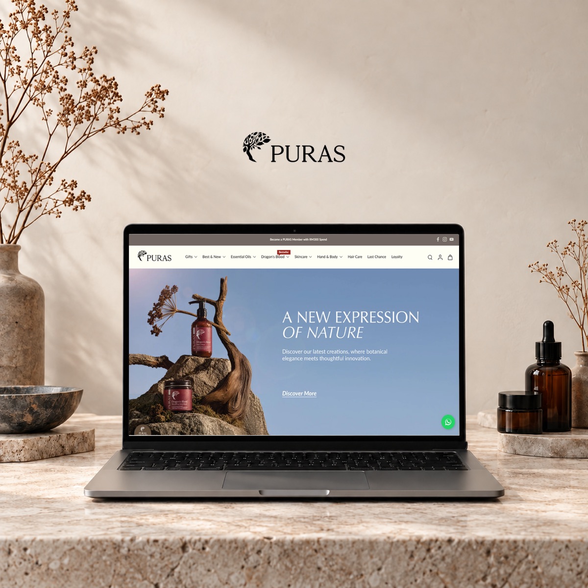 PURAS Shopify theme revamp presented on a laptop in a botanical studio