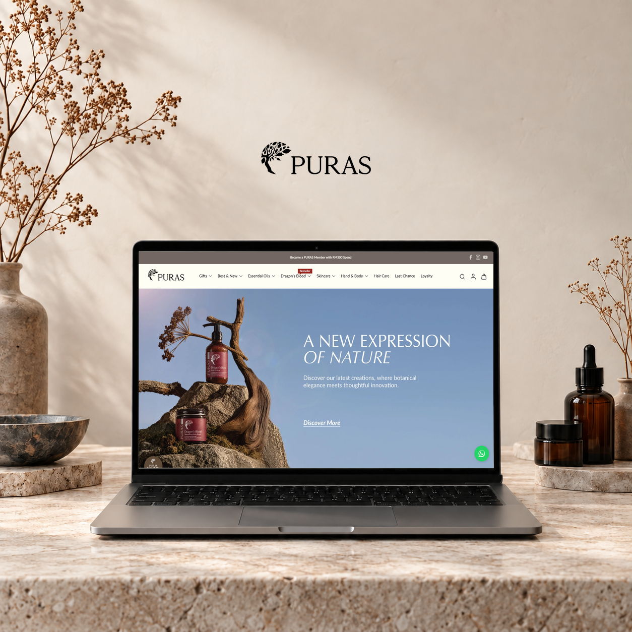 PURAS Shopify theme revamp presented on a laptop in a botanical studio